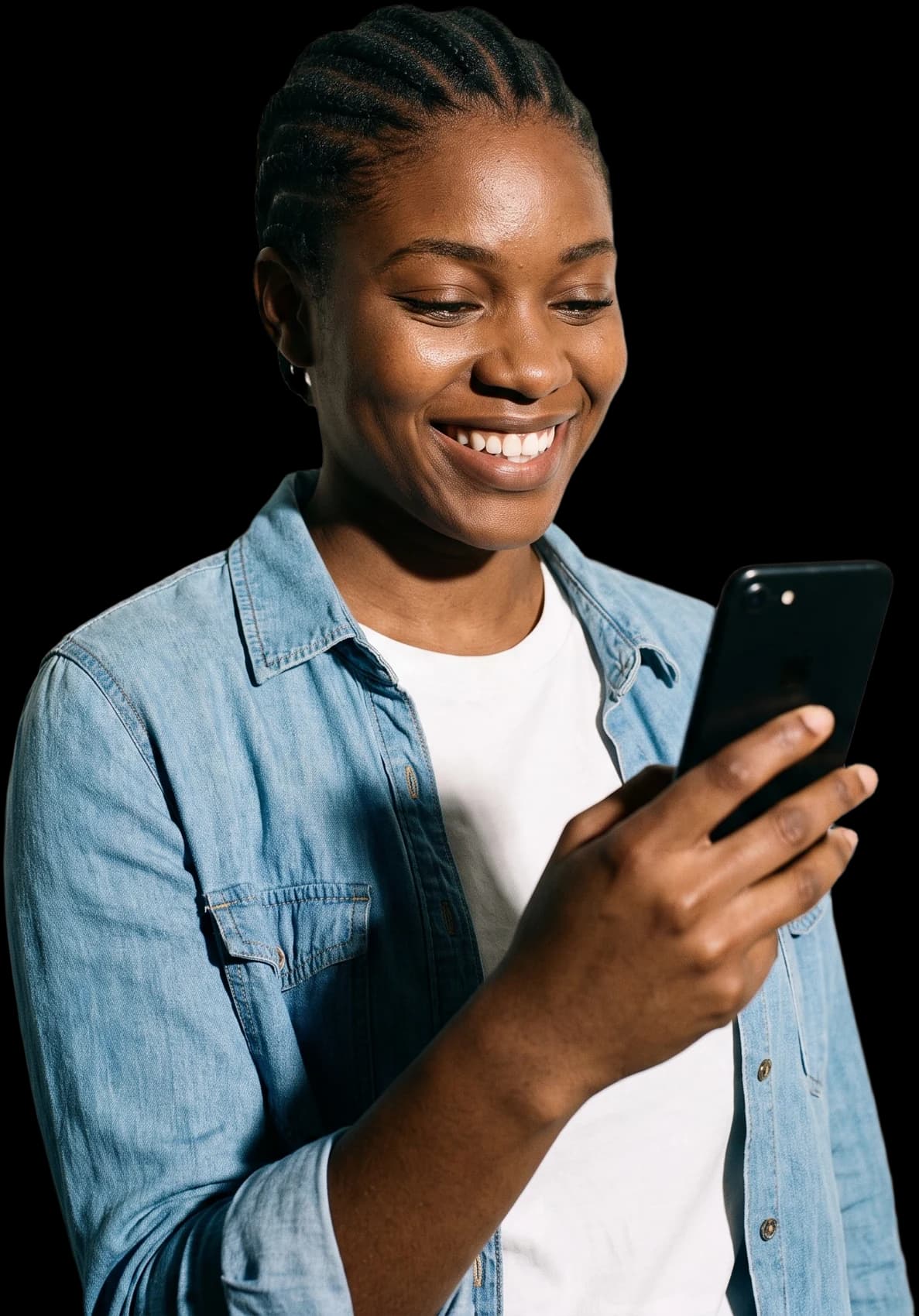 A young woman smiling at her phone
