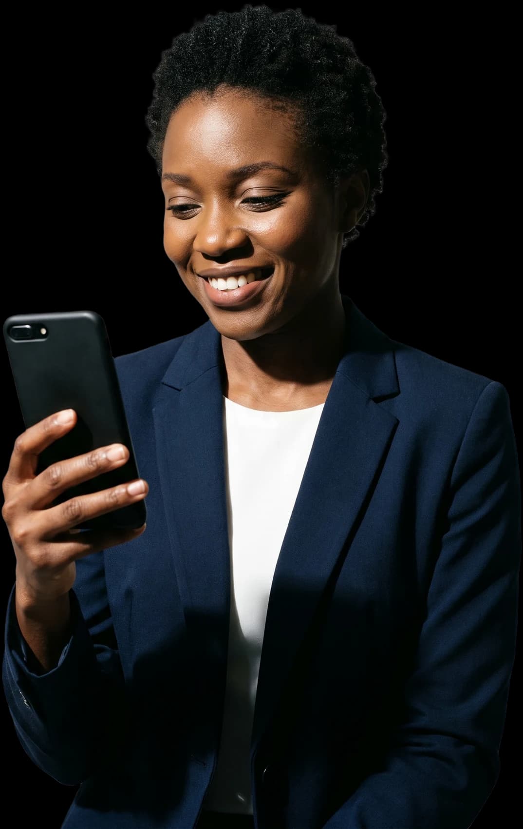 A business owner smiling at her phone